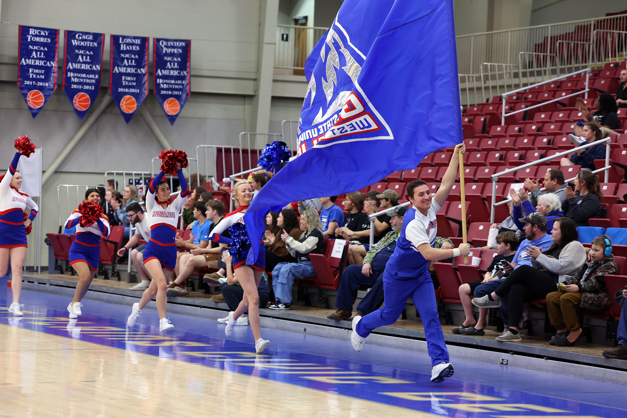Members of the Grizzly Cheer Team at a recent home basketball game. (MSU-WP Photo)