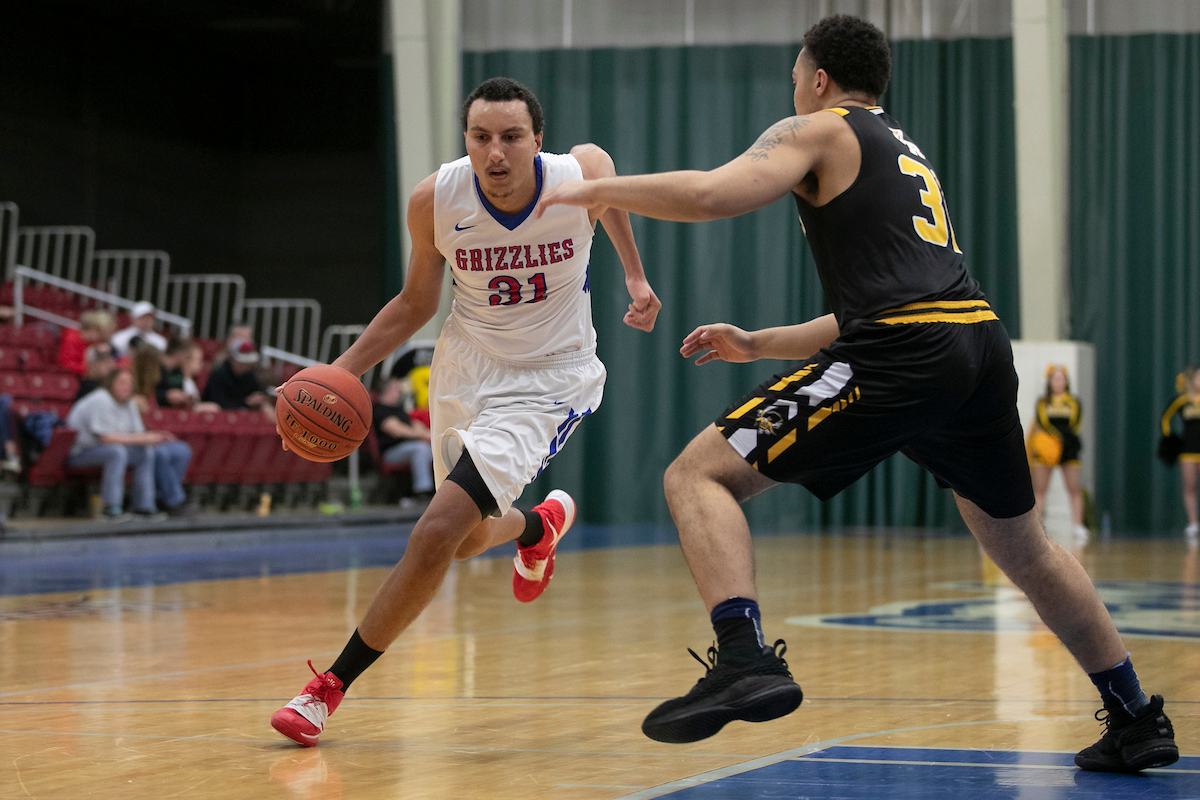 Grizzly Alex Rodrigues (No. 31) drives past a defender during a recent home basketball game. (Missouri State-West Plains Photo)