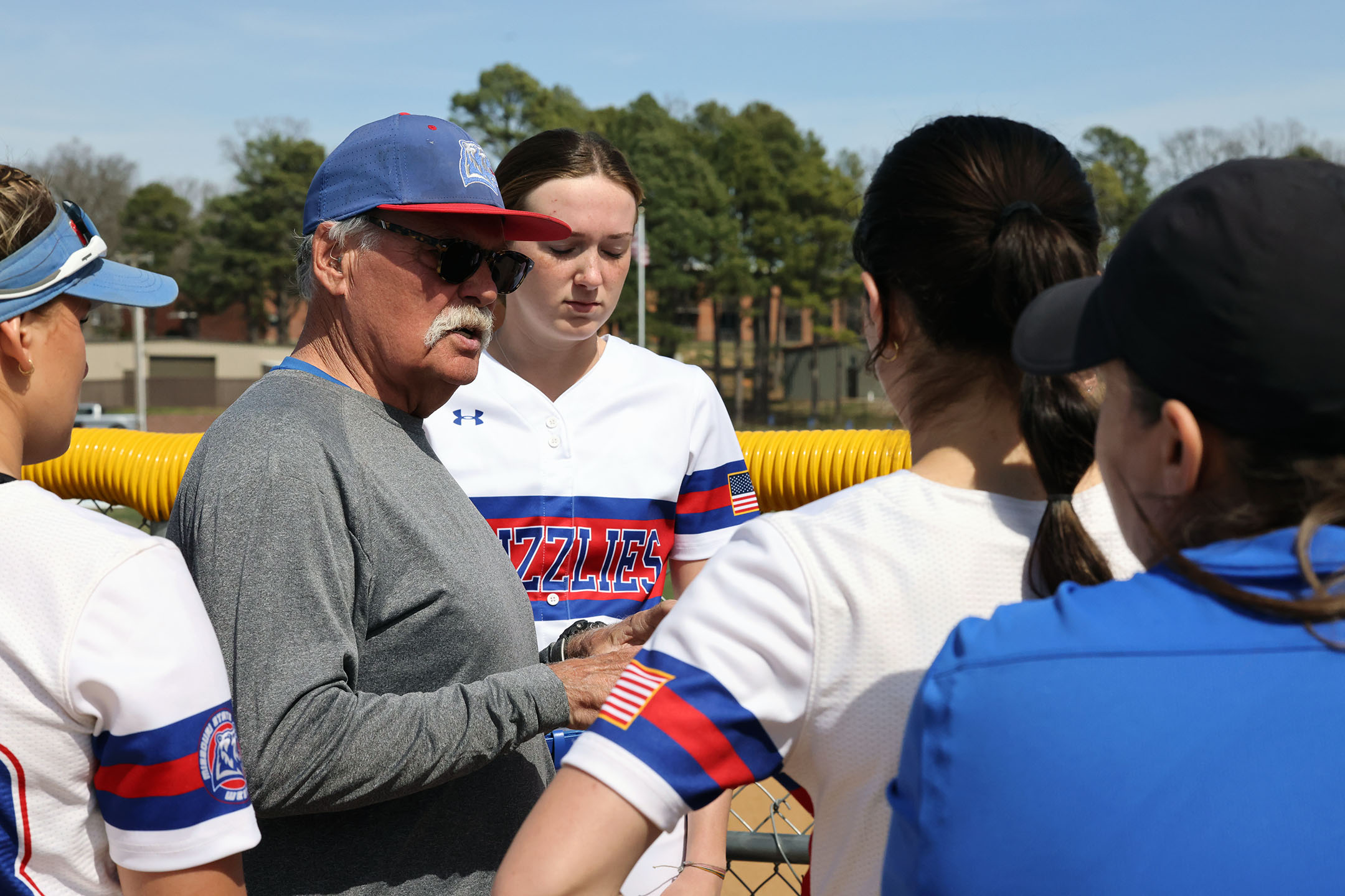 Grizzly Softball Head Coach Don Long gives last minute instructions to his team before a recent home game. (MSU-WP Photo)