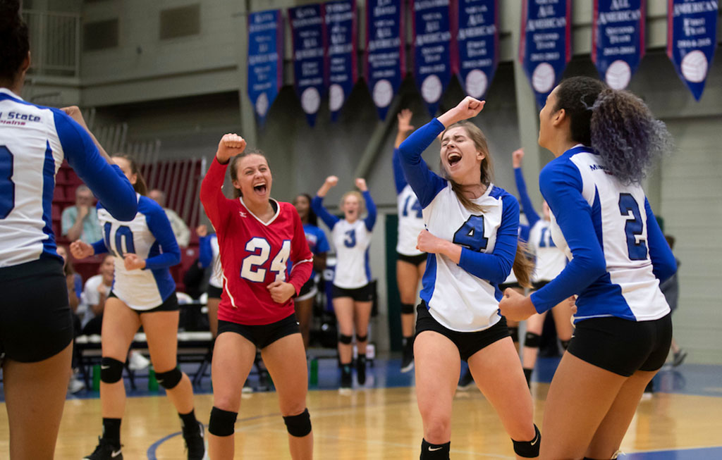 Grizzly Volleyball players, from left, Kamryn Artale, Kelly Wiedemann and Camilly Cristiny celebrate a point during a recent home game. (Missouri State-West Plains Photo)