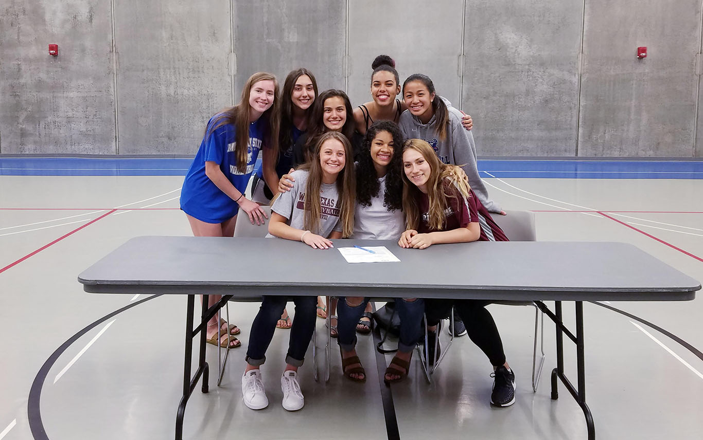 Grizzly Volleyball players Tatjana Trifkovic, Kamryn Artale and Keziah Williams have each signed national letters of intent to play for new teams beginning this fall. On hand for the signings were, seated from left, Artale, Williams and Trifkovic, and teammates, standing from left, Kelly Wiedemann, Maria Louriero, Priscilla Crowell, Camilly Cristiny and Yileen NG He. (Photo provided)