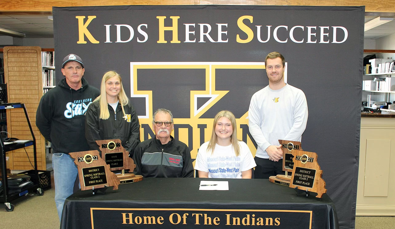 Hadley Wilson, seated right, an infielder from Kennett, recently signed a national letter of intent to play for the Grizzly Softball team beginning in fall 2024. With Wilson above are, seated left, MSU-WP Grizzly Softball Head Coach Don Long and standing from left, Southern Stix travel team coach Bart McAtee, Kennett High School coaches Jessica Baker and Logan Dollins. (Photo provided)